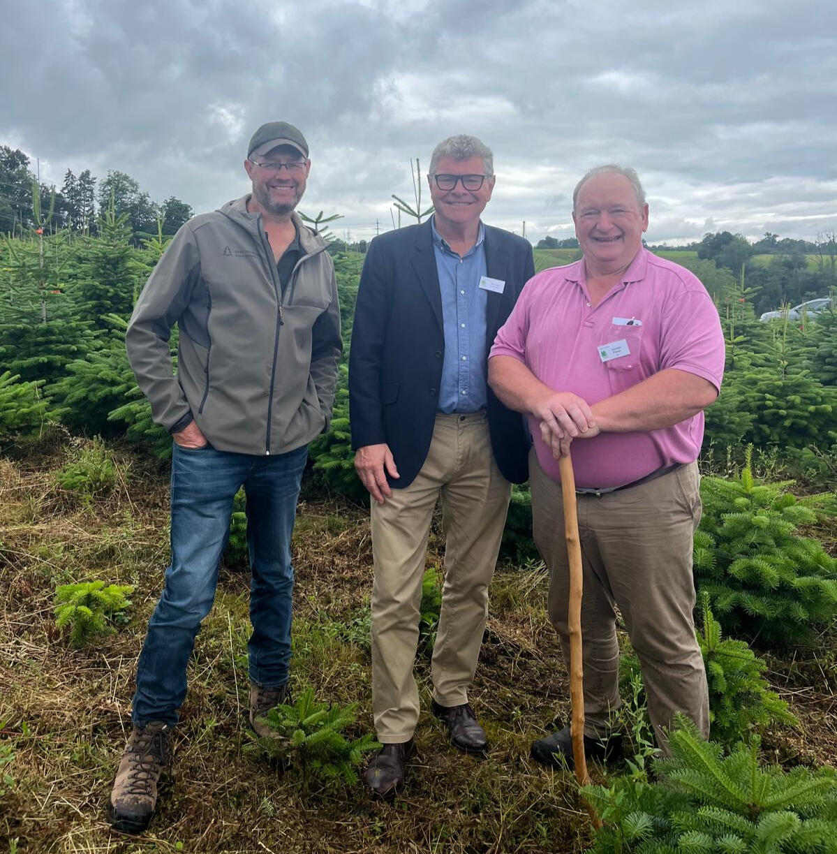 Christmas tree growers in field